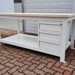 work-bench with plywood platform and chest of drawers