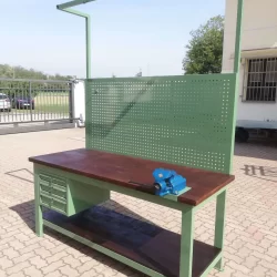 work-bench with wooden platforms tool panel drawers and vice